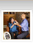 Nurse helps a woman with physical therapy in her home.