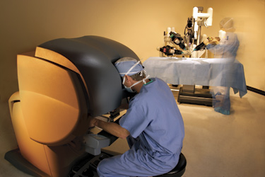 Doctor demonstrates using da vinci robotic technology