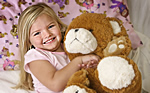 Child with Skyler the bear