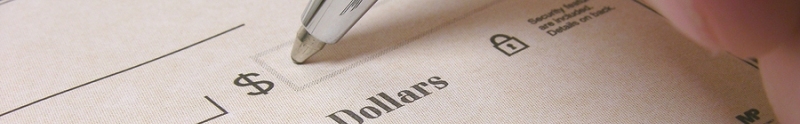 Banner image of a pen filling out a check